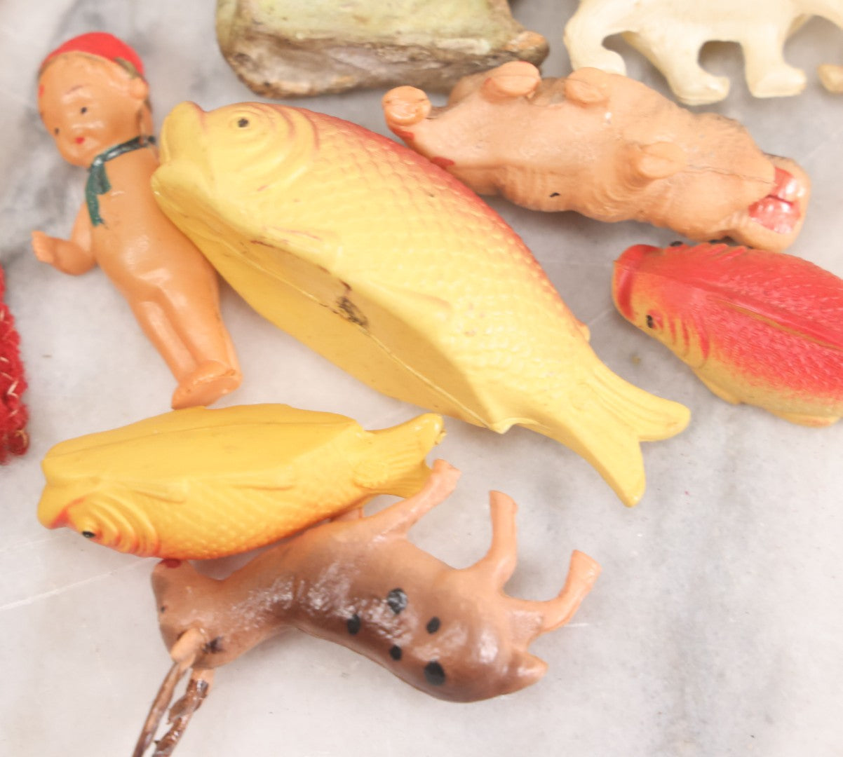 Lot 058 - Box Lot Grouping Of 19 Vintage Celluloid Dolls And Animal Toys Including Hippo, Elephant, Polar Bear, Camel, Donkey, Fish, And More