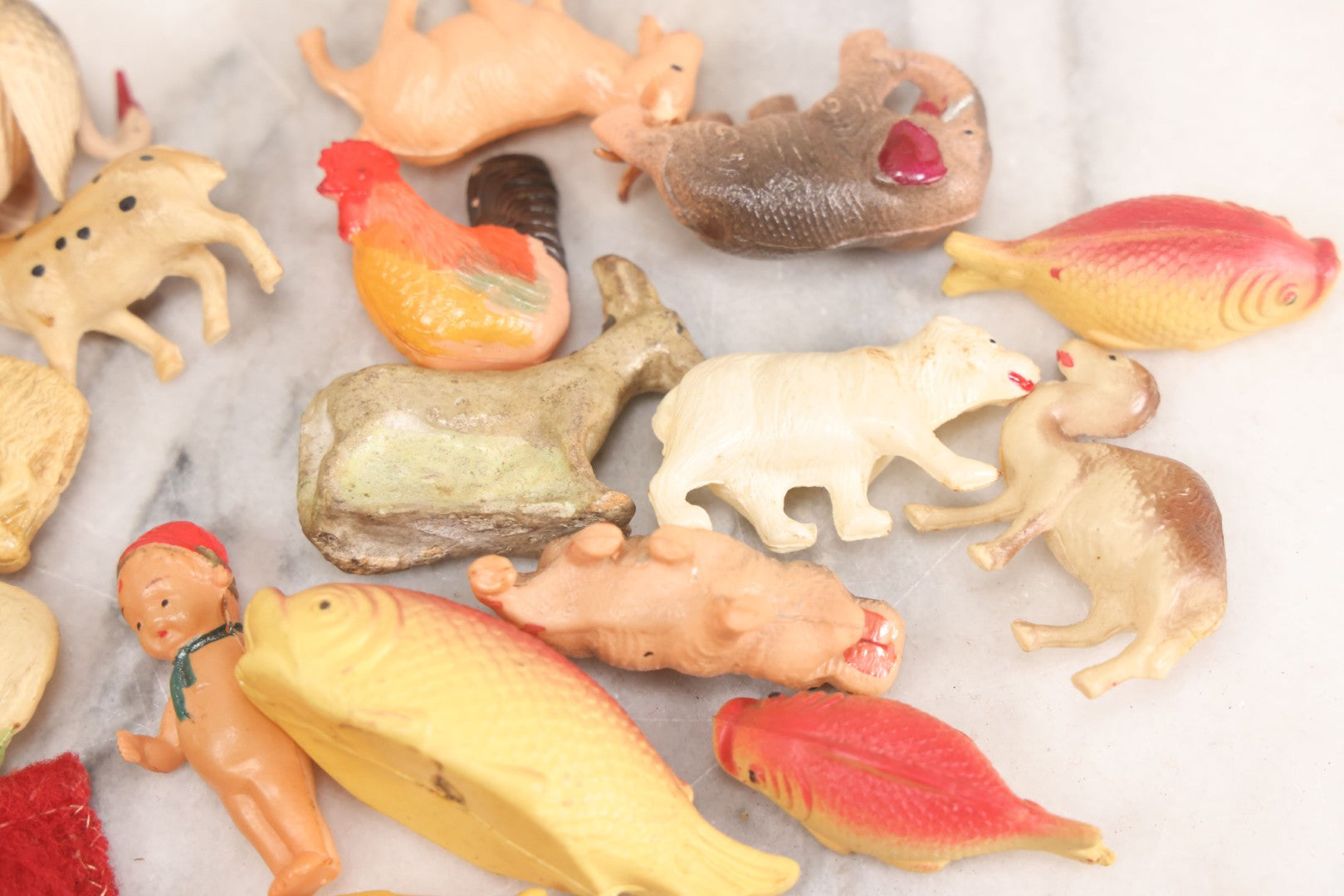 Lot 058 - Box Lot Grouping Of 19 Vintage Celluloid Dolls And Animal Toys Including Hippo, Elephant, Polar Bear, Camel, Donkey, Fish, And More