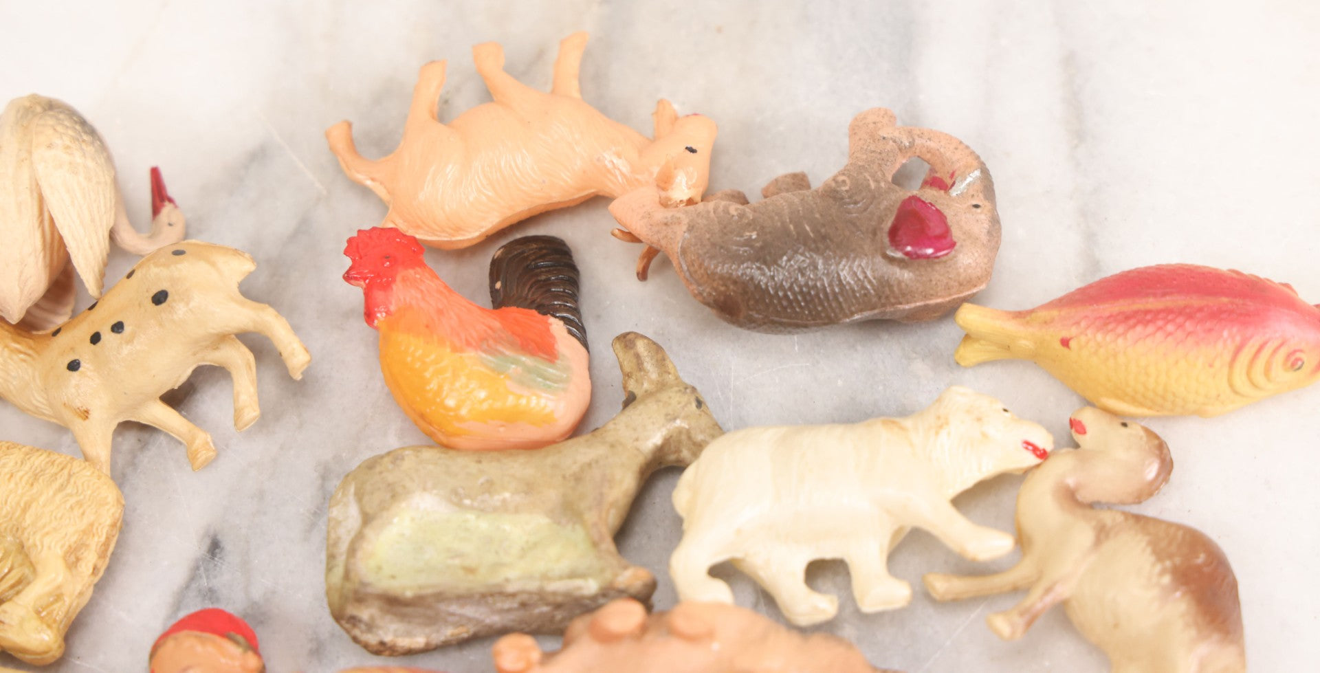Lot 058 - Box Lot Grouping Of 19 Vintage Celluloid Dolls And Animal Toys Including Hippo, Elephant, Polar Bear, Camel, Donkey, Fish, And More