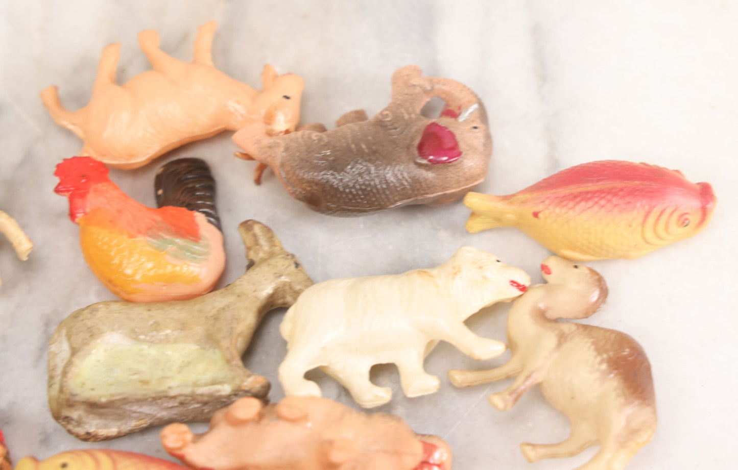 Lot 058 - Box Lot Grouping Of 19 Vintage Celluloid Dolls And Animal Toys Including Hippo, Elephant, Polar Bear, Camel, Donkey, Fish, And More