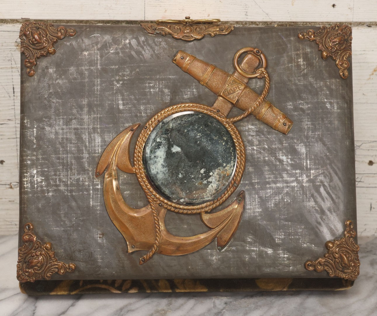 Lot 061 - Antique Victorian Photo Album With Tin Cover And Pressed Brass Anchor "Hope" Motif With Worn Beveled Glass Mirror, And Green Velvet Backing Containing 40+ Cabinet Card And Other Photographs