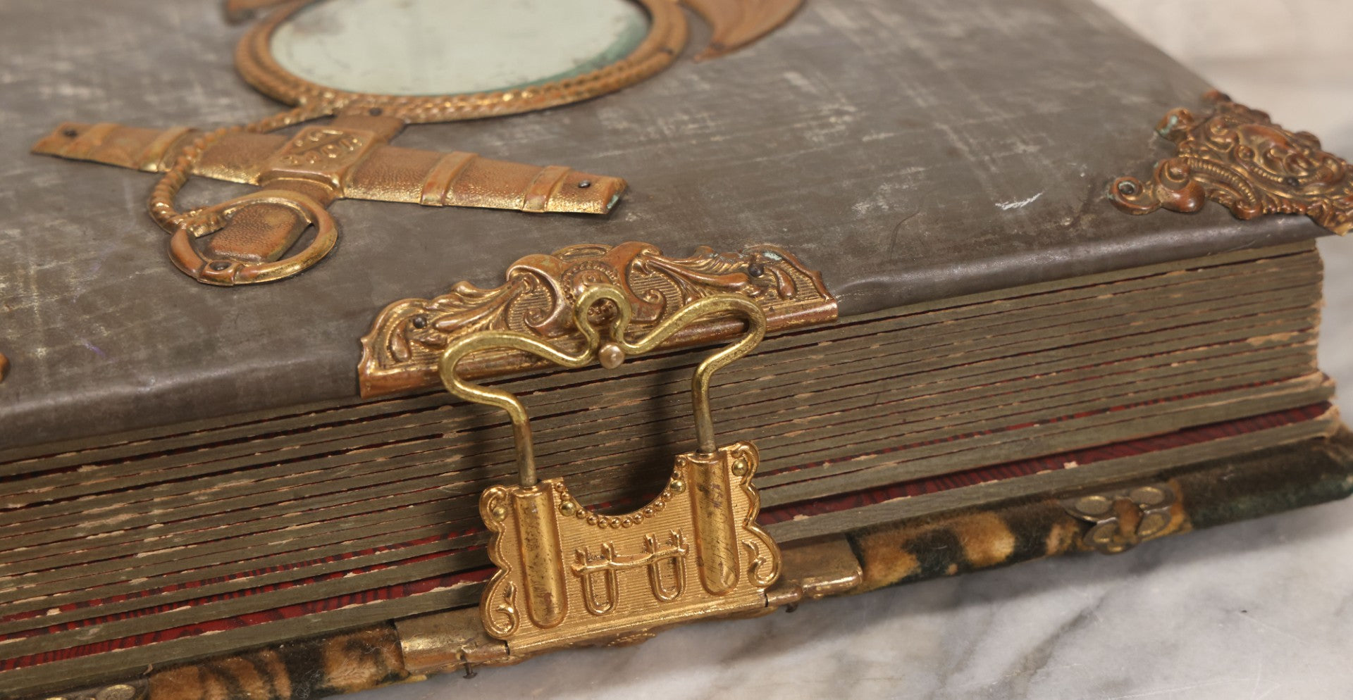 Lot 061 - Antique Victorian Photo Album With Tin Cover And Pressed Brass Anchor "Hope" Motif With Worn Beveled Glass Mirror, And Green Velvet Backing Containing 40+ Cabinet Card And Other Photographs