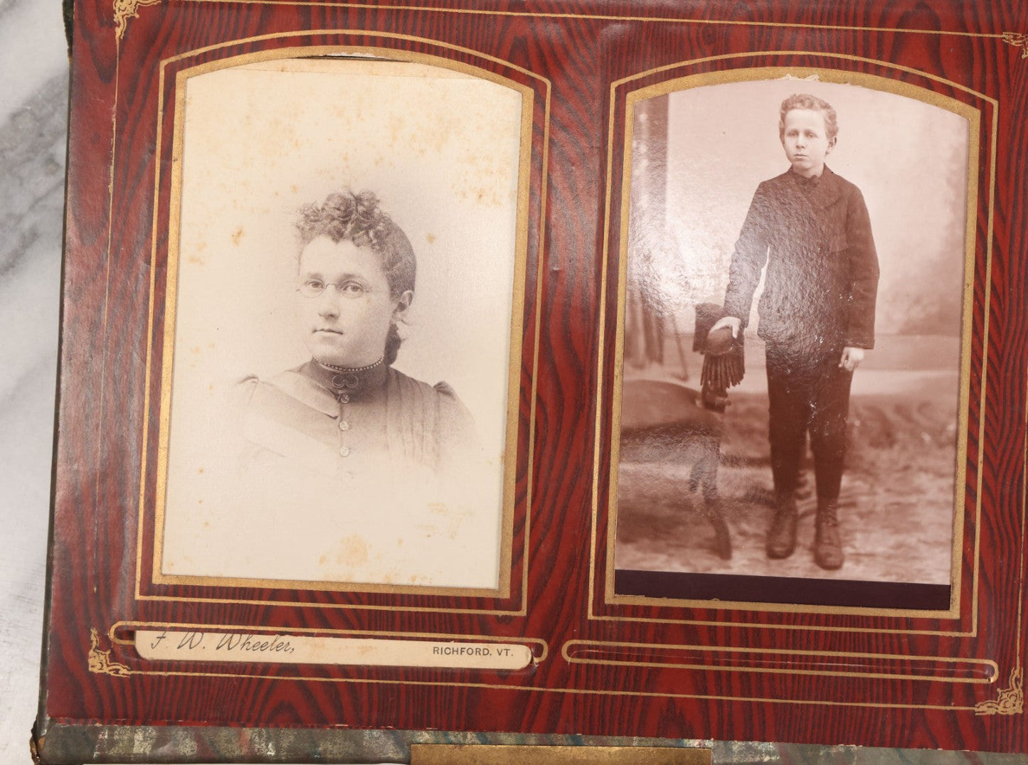 Lot 061 - Antique Victorian Photo Album With Tin Cover And Pressed Brass Anchor "Hope" Motif With Worn Beveled Glass Mirror, And Green Velvet Backing Containing 40+ Cabinet Card And Other Photographs