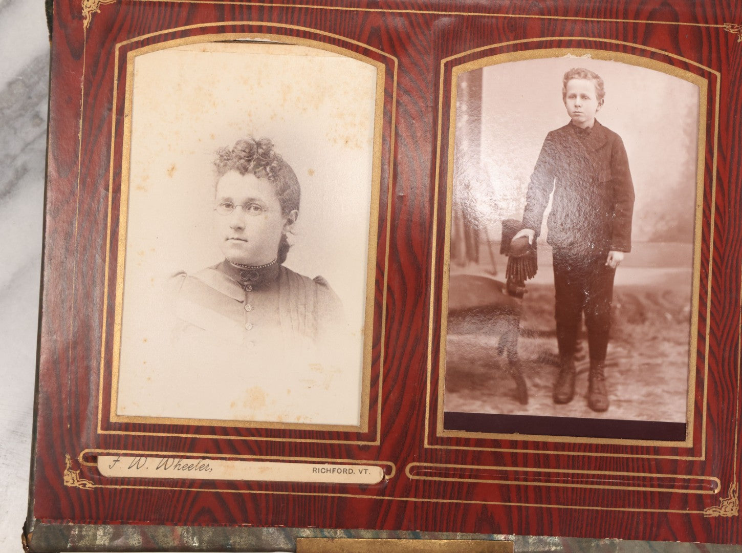 Lot 061 - Antique Victorian Photo Album With Tin Cover And Pressed Brass Anchor "Hope" Motif With Worn Beveled Glass Mirror, And Green Velvet Backing Containing 40+ Cabinet Card And Other Photographs