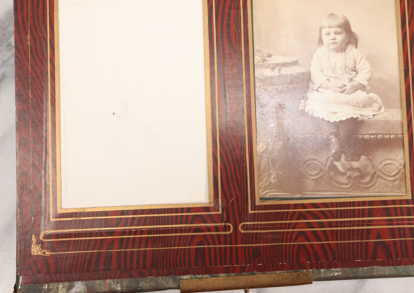 Lot 061 - Antique Victorian Photo Album With Tin Cover And Pressed Brass Anchor "Hope" Motif With Worn Beveled Glass Mirror, And Green Velvet Backing Containing 40+ Cabinet Card And Other Photographs