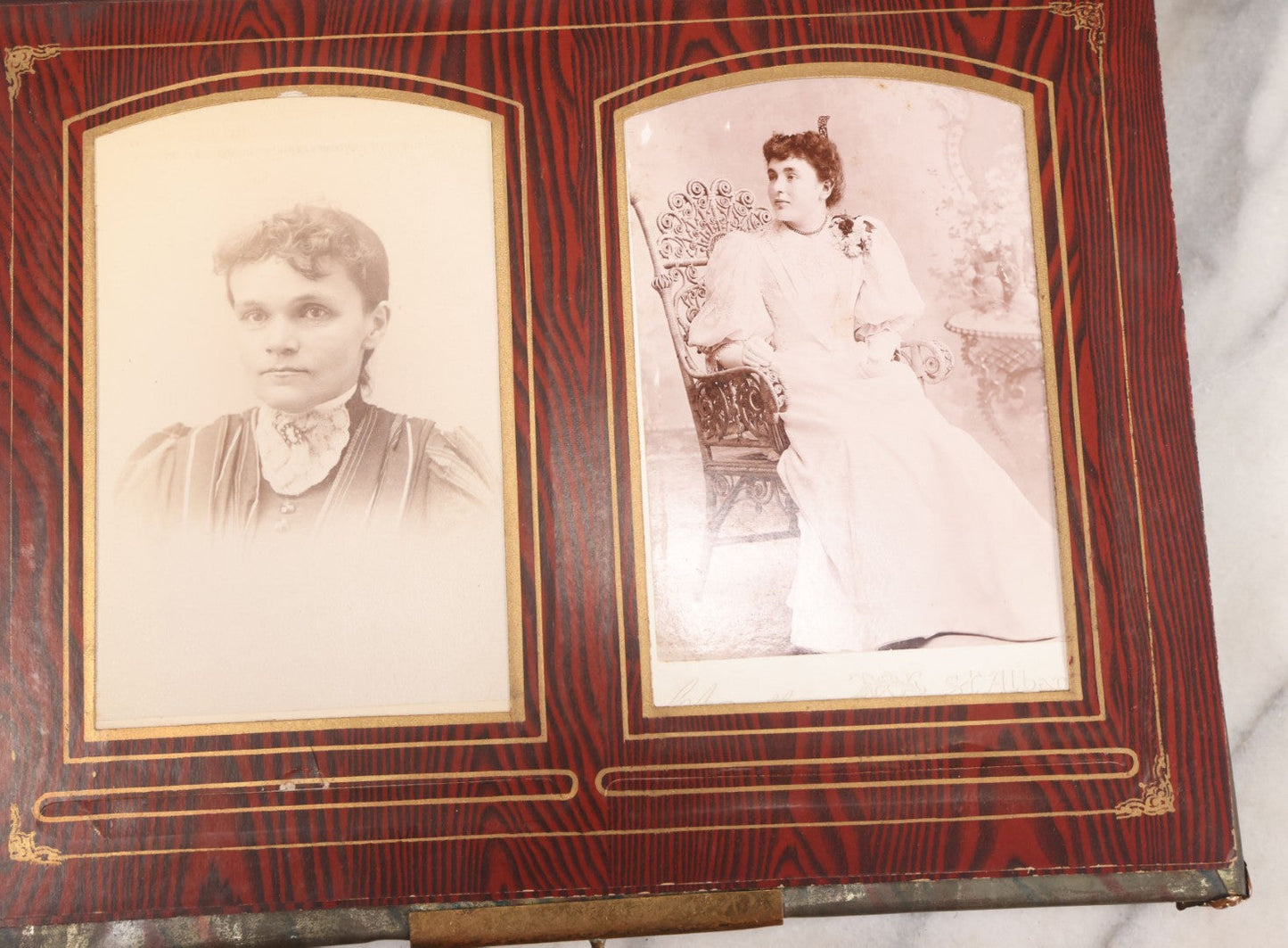 Lot 061 - Antique Victorian Photo Album With Tin Cover And Pressed Brass Anchor "Hope" Motif With Worn Beveled Glass Mirror, And Green Velvet Backing Containing 40+ Cabinet Card And Other Photographs