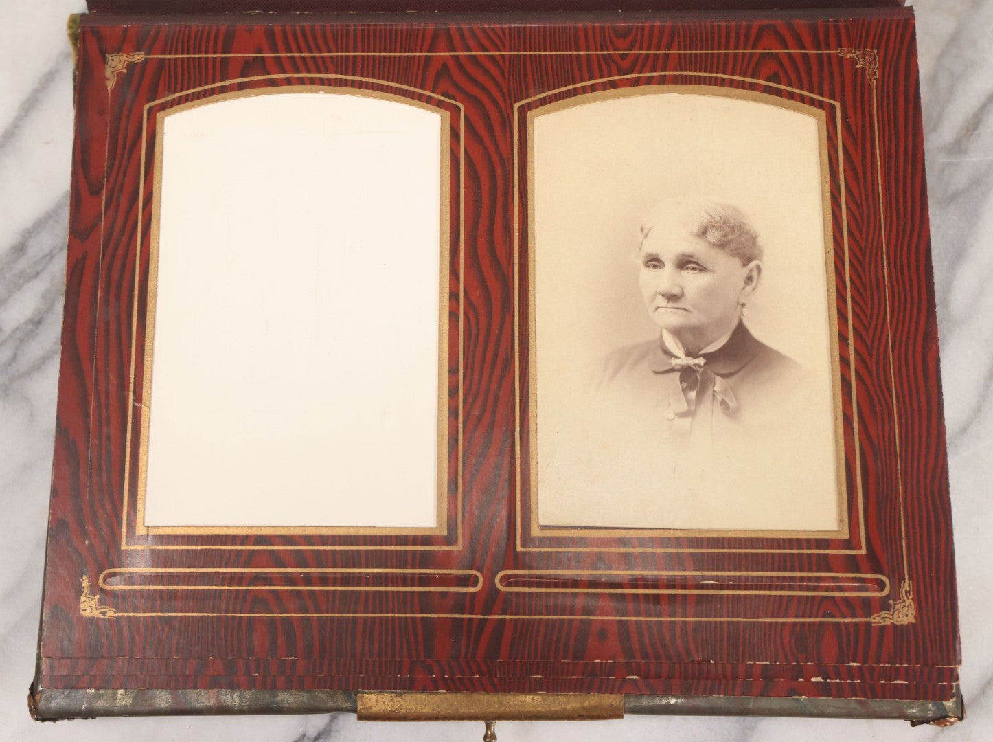 Lot 061 - Antique Victorian Photo Album With Tin Cover And Pressed Brass Anchor "Hope" Motif With Worn Beveled Glass Mirror, And Green Velvet Backing Containing 40+ Cabinet Card And Other Photographs