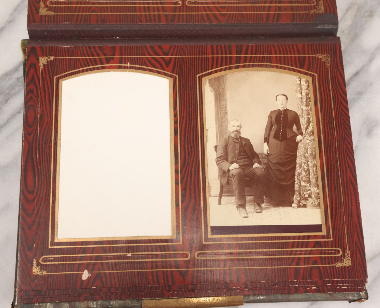 Lot 061 - Antique Victorian Photo Album With Tin Cover And Pressed Brass Anchor "Hope" Motif With Worn Beveled Glass Mirror, And Green Velvet Backing Containing 40+ Cabinet Card And Other Photographs