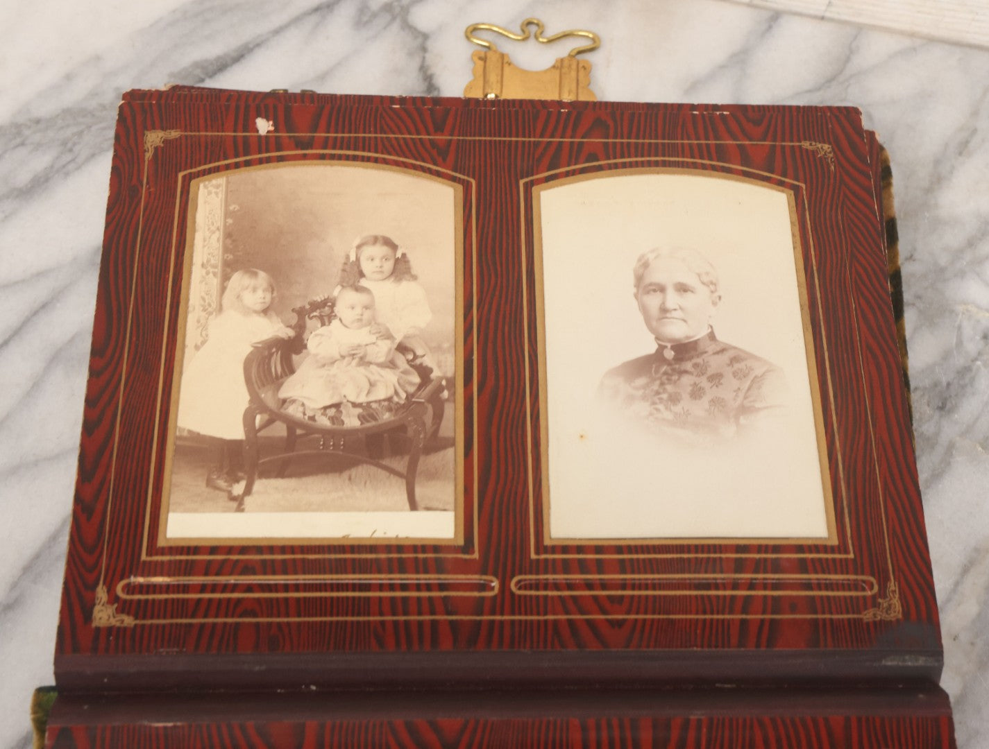 Lot 061 - Antique Victorian Photo Album With Tin Cover And Pressed Brass Anchor "Hope" Motif With Worn Beveled Glass Mirror, And Green Velvet Backing Containing 40+ Cabinet Card And Other Photographs