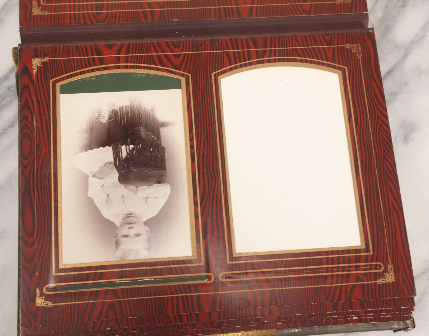 Lot 061 - Antique Victorian Photo Album With Tin Cover And Pressed Brass Anchor "Hope" Motif With Worn Beveled Glass Mirror, And Green Velvet Backing Containing 40+ Cabinet Card And Other Photographs