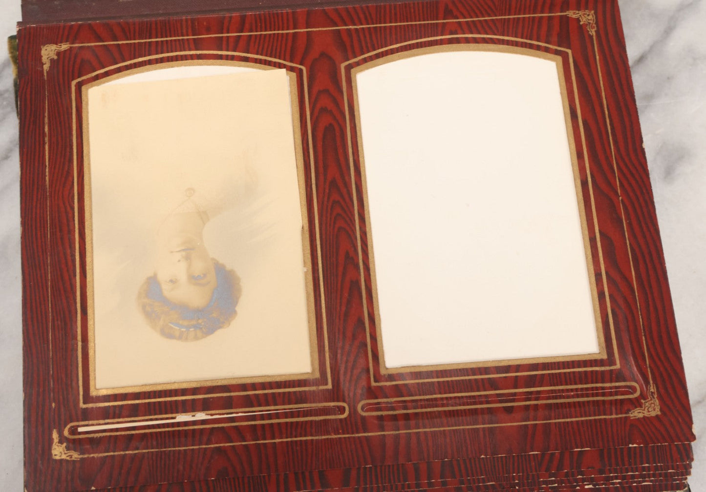 Lot 061 - Antique Victorian Photo Album With Tin Cover And Pressed Brass Anchor "Hope" Motif With Worn Beveled Glass Mirror, And Green Velvet Backing Containing 40+ Cabinet Card And Other Photographs