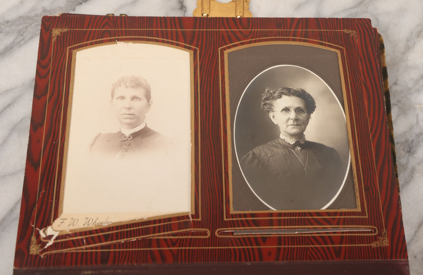 Lot 061 - Antique Victorian Photo Album With Tin Cover And Pressed Brass Anchor "Hope" Motif With Worn Beveled Glass Mirror, And Green Velvet Backing Containing 40+ Cabinet Card And Other Photographs