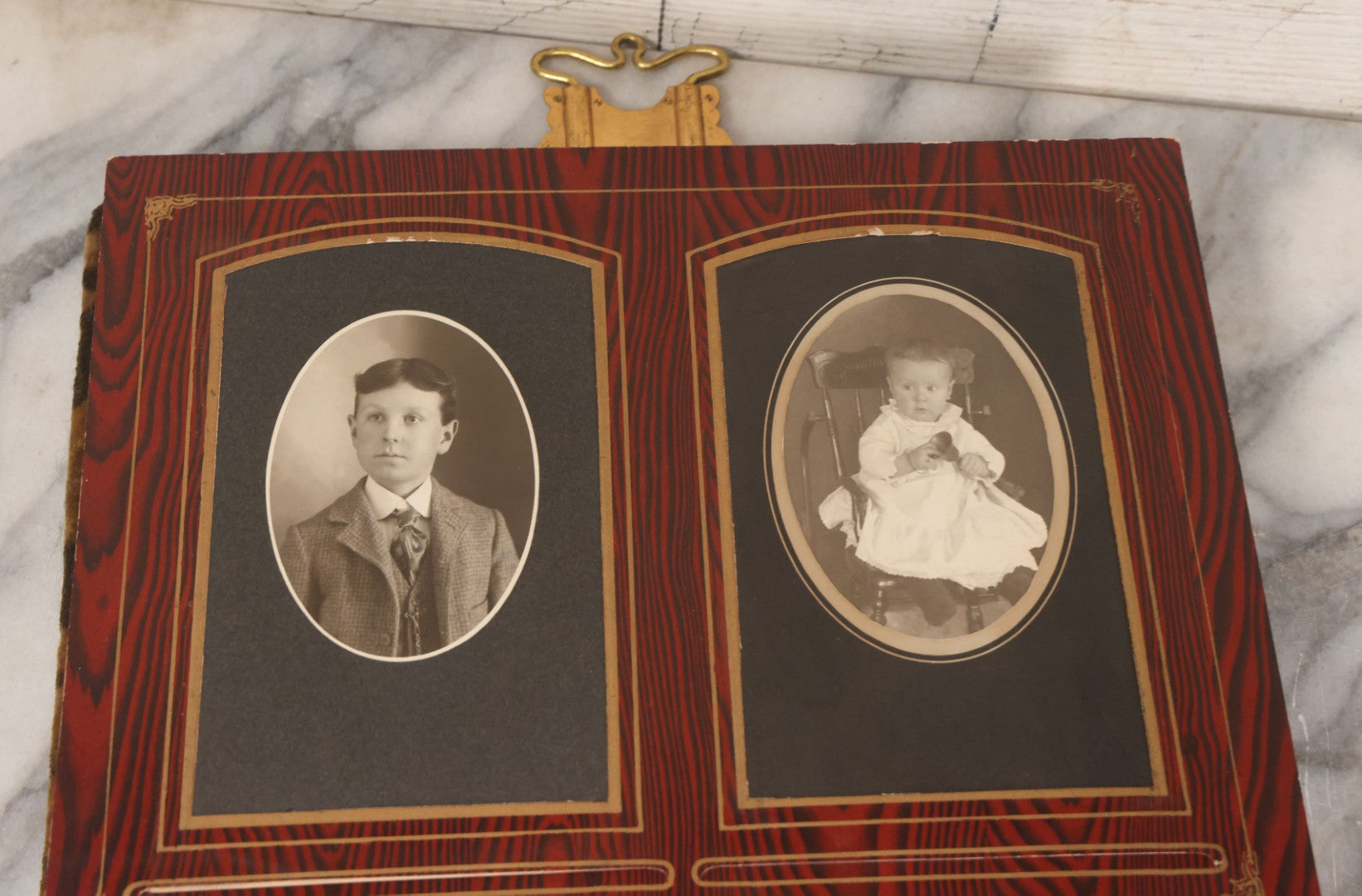 Lot 061 - Antique Victorian Photo Album With Tin Cover And Pressed Brass Anchor "Hope" Motif With Worn Beveled Glass Mirror, And Green Velvet Backing Containing 40+ Cabinet Card And Other Photographs