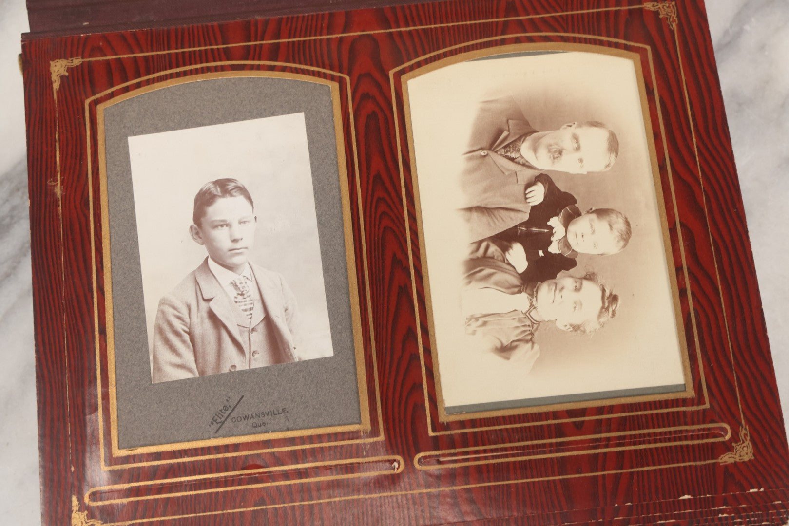 Lot 061 - Antique Victorian Photo Album With Tin Cover And Pressed Brass Anchor "Hope" Motif With Worn Beveled Glass Mirror, And Green Velvet Backing Containing 40+ Cabinet Card And Other Photographs