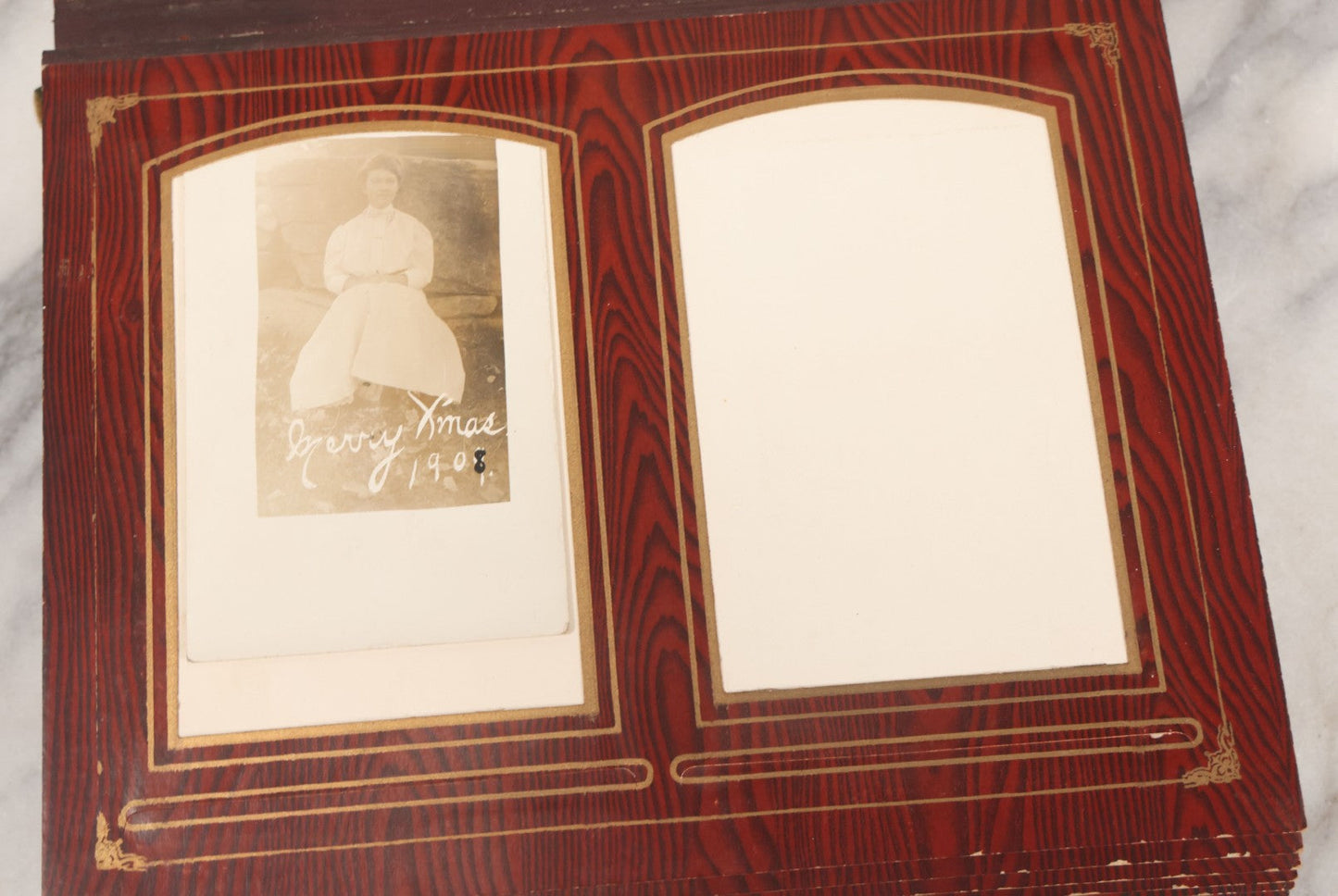 Lot 061 - Antique Victorian Photo Album With Tin Cover And Pressed Brass Anchor "Hope" Motif With Worn Beveled Glass Mirror, And Green Velvet Backing Containing 40+ Cabinet Card And Other Photographs