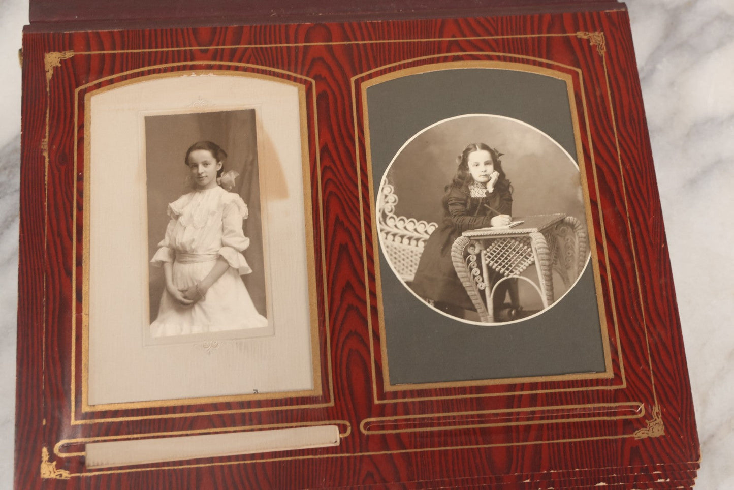 Lot 061 - Antique Victorian Photo Album With Tin Cover And Pressed Brass Anchor "Hope" Motif With Worn Beveled Glass Mirror, And Green Velvet Backing Containing 40+ Cabinet Card And Other Photographs