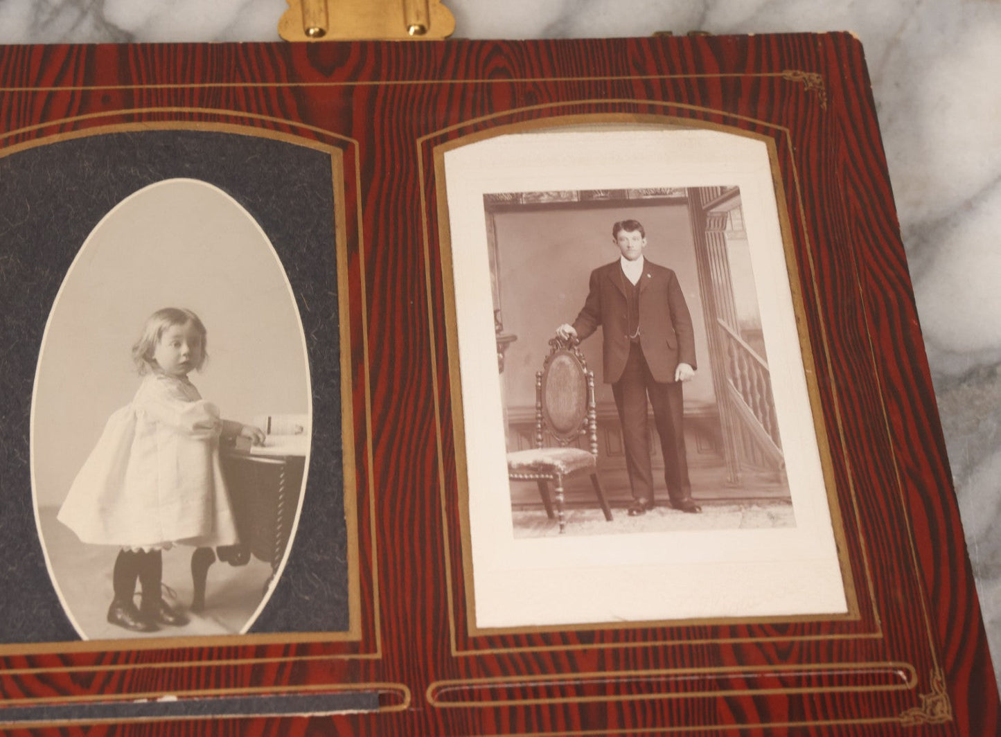 Lot 061 - Antique Victorian Photo Album With Tin Cover And Pressed Brass Anchor "Hope" Motif With Worn Beveled Glass Mirror, And Green Velvet Backing Containing 40+ Cabinet Card And Other Photographs