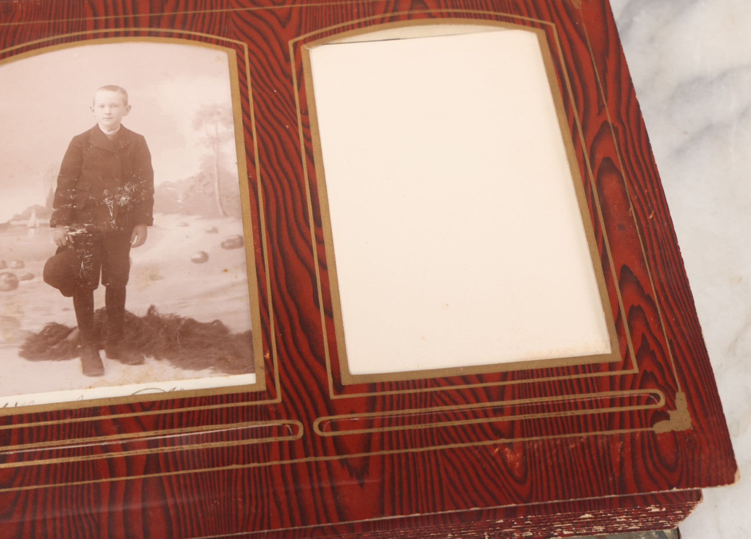 Lot 061 - Antique Victorian Photo Album With Tin Cover And Pressed Brass Anchor "Hope" Motif With Worn Beveled Glass Mirror, And Green Velvet Backing Containing 40+ Cabinet Card And Other Photographs