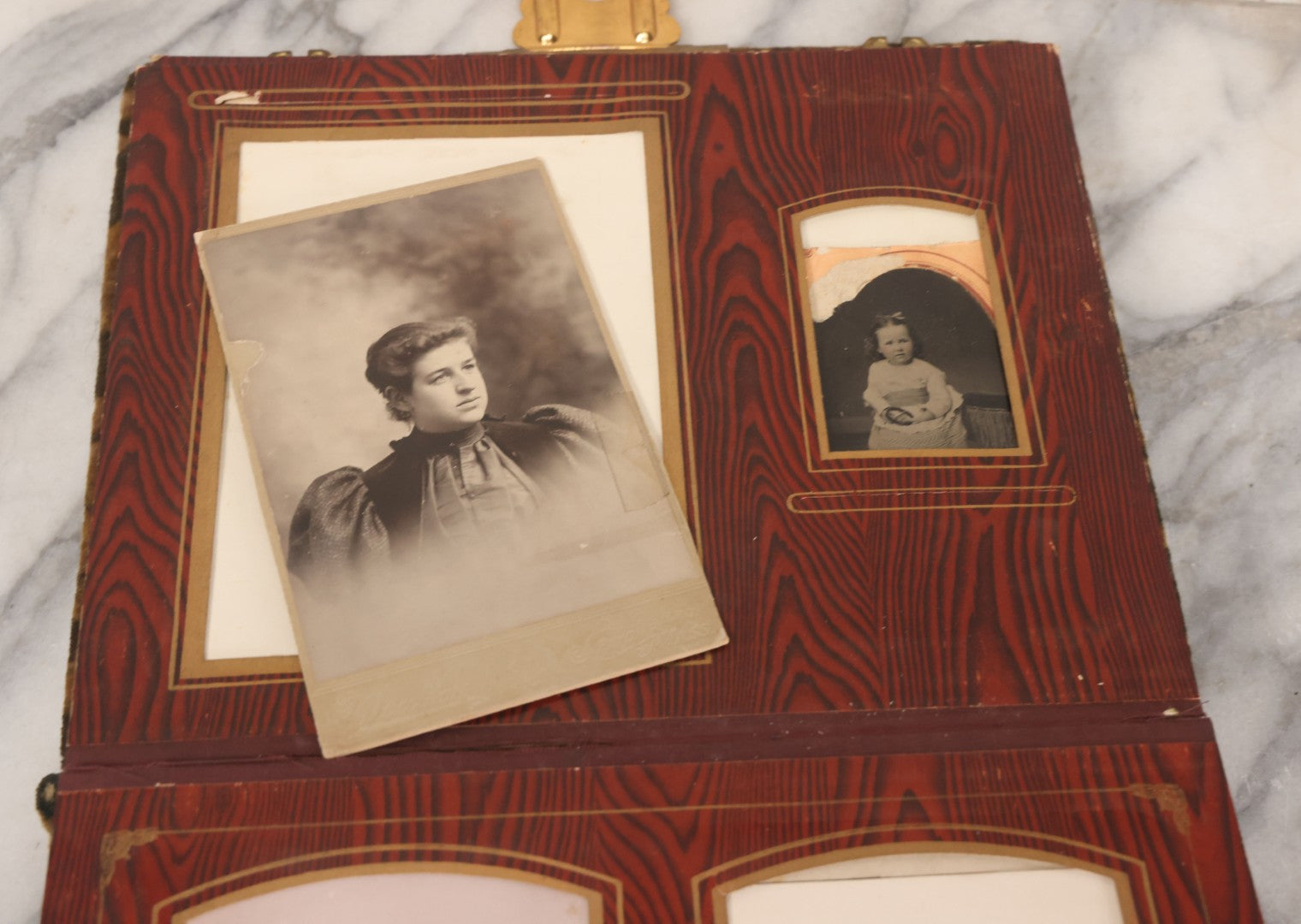 Lot 061 - Antique Victorian Photo Album With Tin Cover And Pressed Brass Anchor "Hope" Motif With Worn Beveled Glass Mirror, And Green Velvet Backing Containing 40+ Cabinet Card And Other Photographs