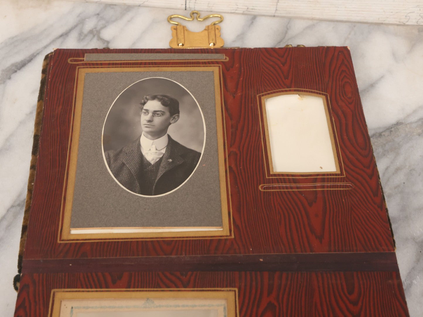 Lot 061 - Antique Victorian Photo Album With Tin Cover And Pressed Brass Anchor "Hope" Motif With Worn Beveled Glass Mirror, And Green Velvet Backing Containing 40+ Cabinet Card And Other Photographs