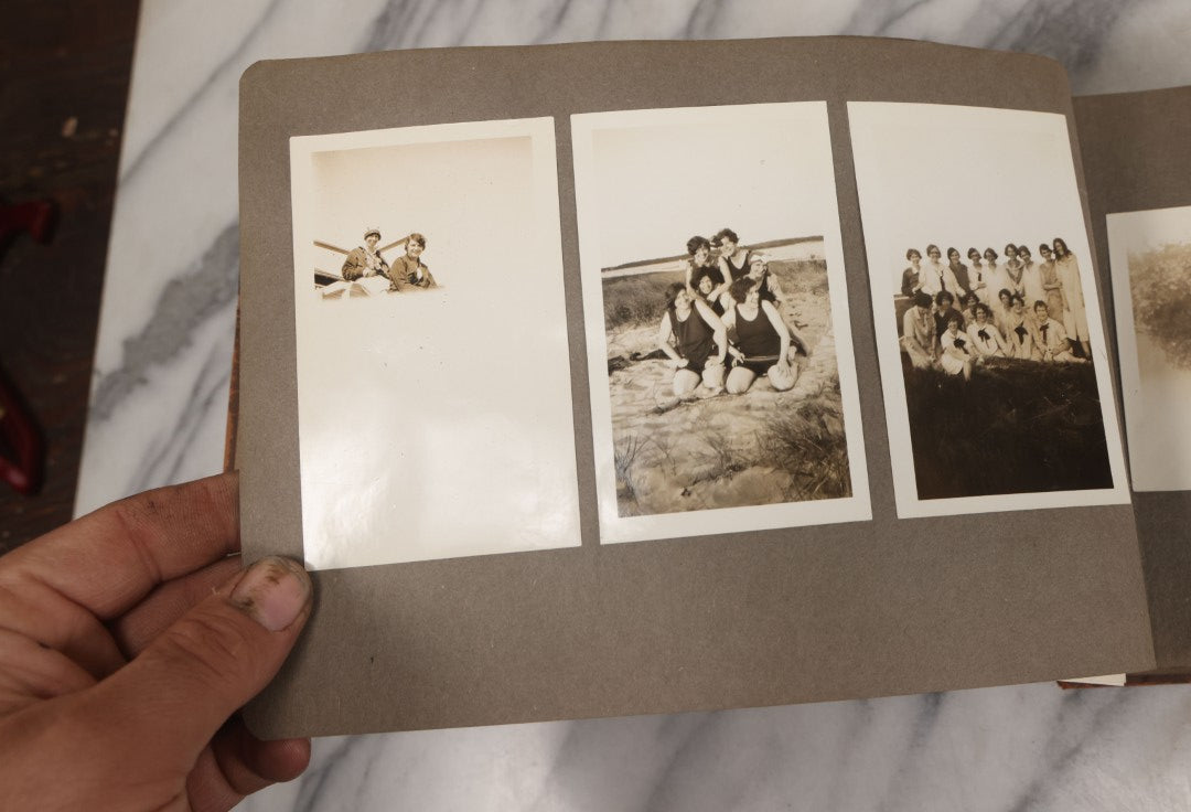 Lot 062 - Vintage Snapshot Photo Album With 125+ Photographs Including Photos Of Spirit Of St. Louis Plane, Redwood Forest, Automobiles, Outings, Comic Wedding Posters, Statue Of Liberty, Beachwear, And More