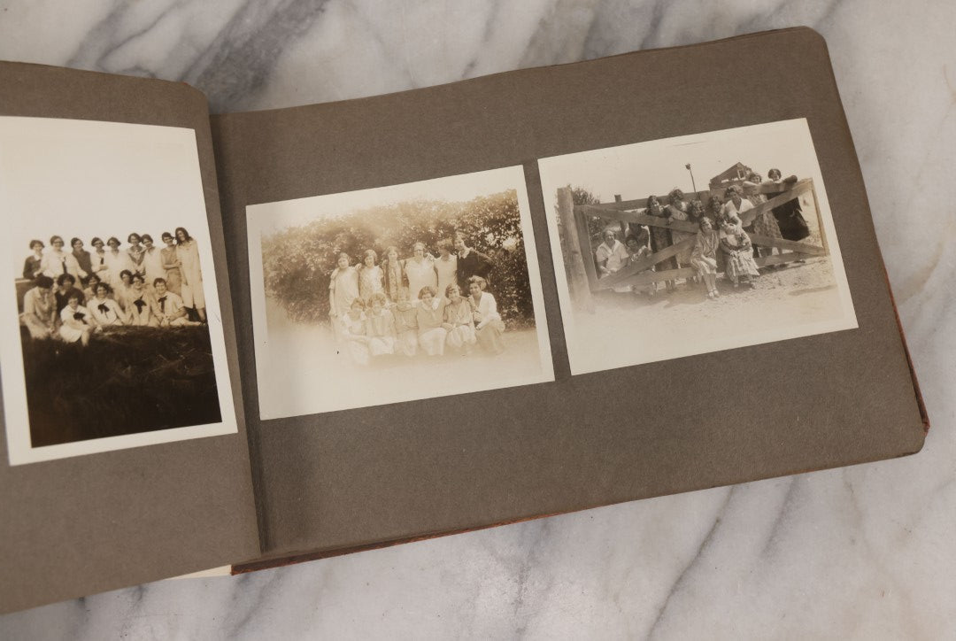 Lot 062 - Vintage Snapshot Photo Album With 125+ Photographs Including Photos Of Spirit Of St. Louis Plane, Redwood Forest, Automobiles, Outings, Comic Wedding Posters, Statue Of Liberty, Beachwear, And More