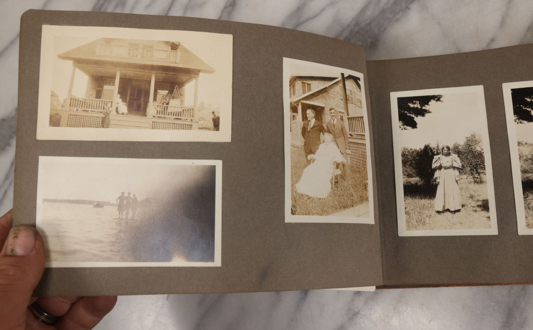 Lot 062 - Vintage Snapshot Photo Album With 125+ Photographs Including Photos Of Spirit Of St. Louis Plane, Redwood Forest, Automobiles, Outings, Comic Wedding Posters, Statue Of Liberty, Beachwear, And More