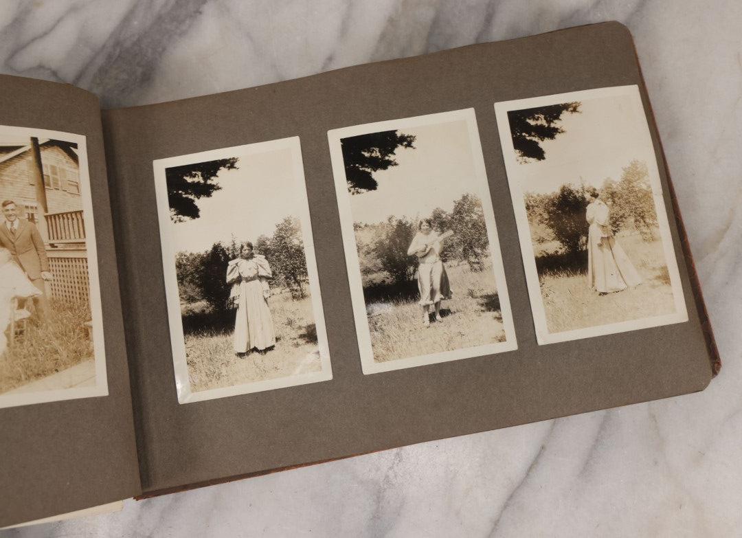 Lot 062 - Vintage Snapshot Photo Album With 125+ Photographs Including Photos Of Spirit Of St. Louis Plane, Redwood Forest, Automobiles, Outings, Comic Wedding Posters, Statue Of Liberty, Beachwear, And More