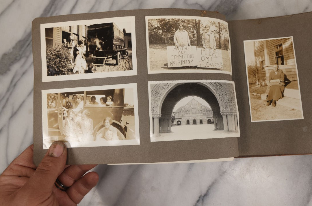 Lot 062 - Vintage Snapshot Photo Album With 125+ Photographs Including Photos Of Spirit Of St. Louis Plane, Redwood Forest, Automobiles, Outings, Comic Wedding Posters, Statue Of Liberty, Beachwear, And More