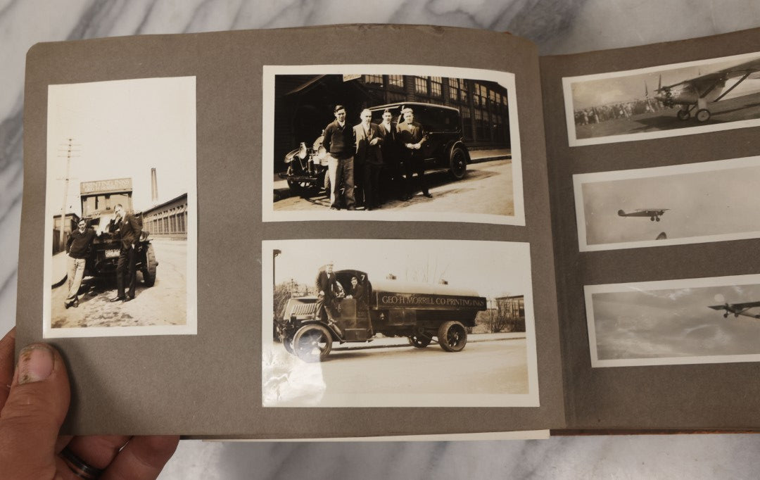 Lot 062 - Vintage Snapshot Photo Album With 125+ Photographs Including Photos Of Spirit Of St. Louis Plane, Redwood Forest, Automobiles, Outings, Comic Wedding Posters, Statue Of Liberty, Beachwear, And More
