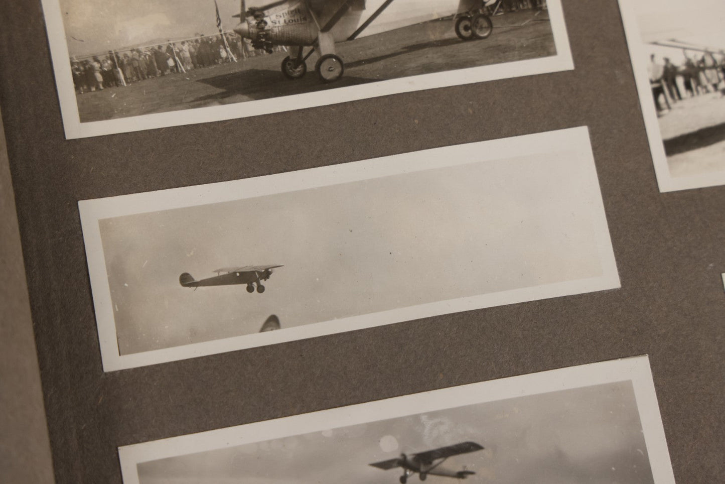 Lot 062 - Vintage Snapshot Photo Album With 125+ Photographs Including Photos Of Spirit Of St. Louis Plane, Redwood Forest, Automobiles, Outings, Comic Wedding Posters, Statue Of Liberty, Beachwear, And More