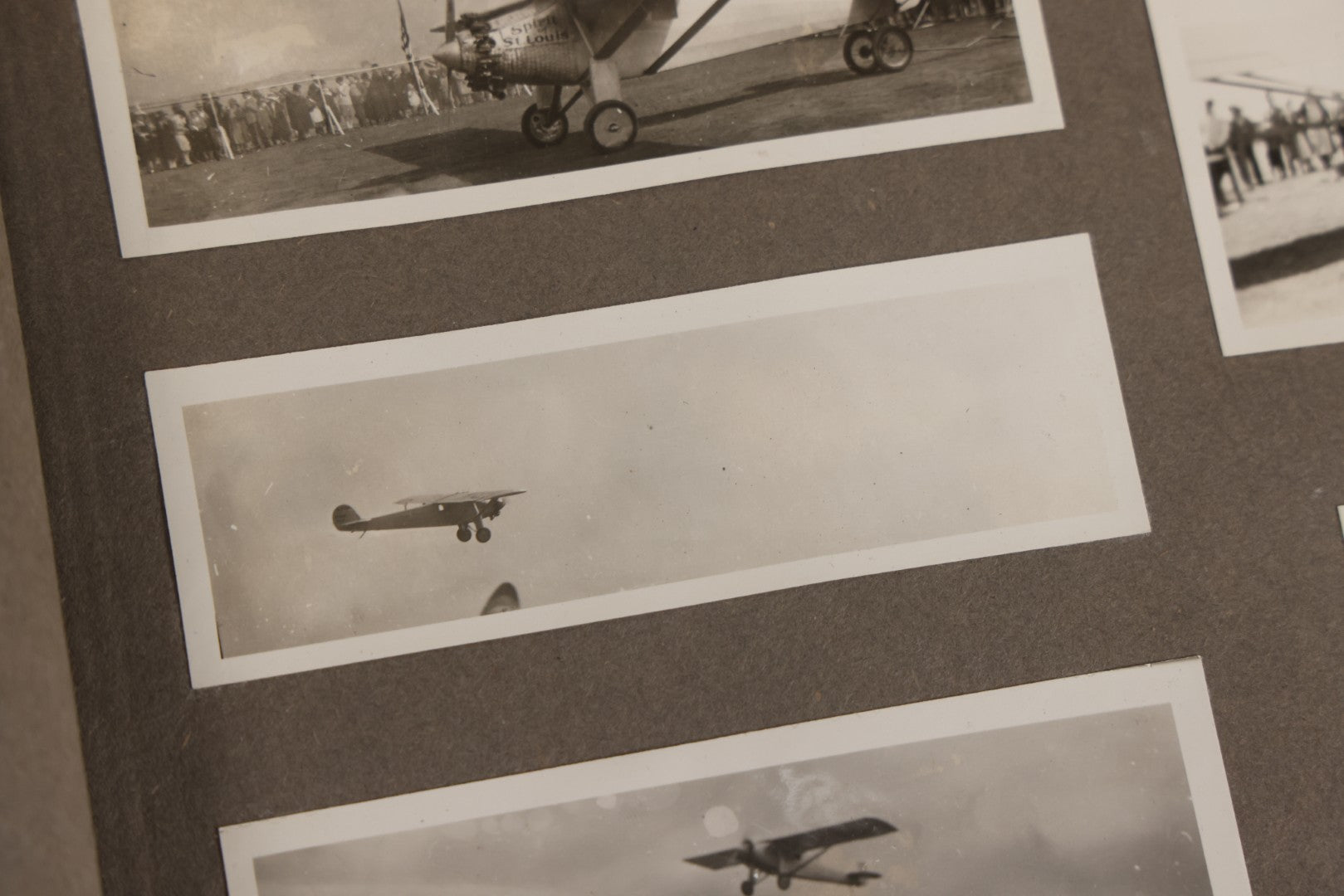 Lot 062 - Vintage Snapshot Photo Album With 125+ Photographs Including Photos Of Spirit Of St. Louis Plane, Redwood Forest, Automobiles, Outings, Comic Wedding Posters, Statue Of Liberty, Beachwear, And More