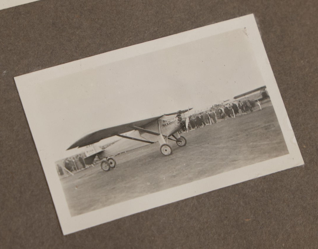 Lot 062 - Vintage Snapshot Photo Album With 125+ Photographs Including Photos Of Spirit Of St. Louis Plane, Redwood Forest, Automobiles, Outings, Comic Wedding Posters, Statue Of Liberty, Beachwear, And More