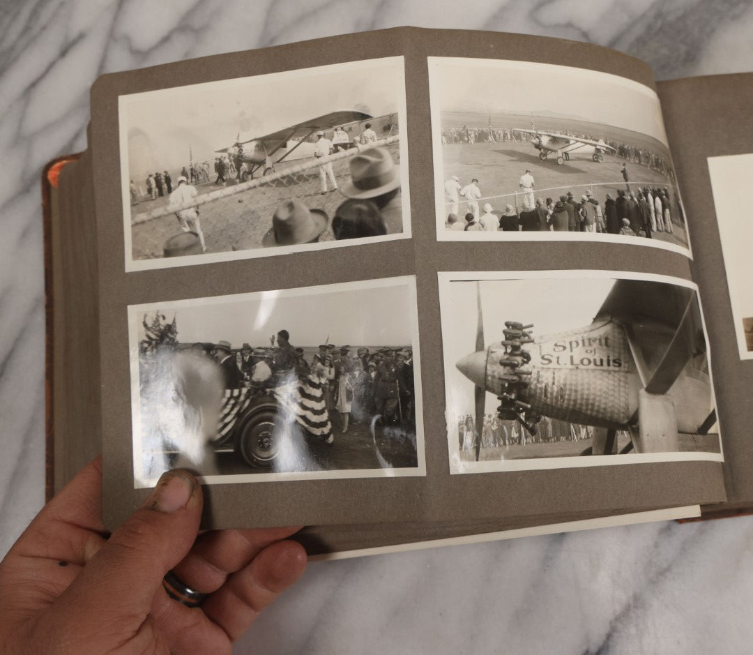 Lot 062 - Vintage Snapshot Photo Album With 125+ Photographs Including Photos Of Spirit Of St. Louis Plane, Redwood Forest, Automobiles, Outings, Comic Wedding Posters, Statue Of Liberty, Beachwear, And More