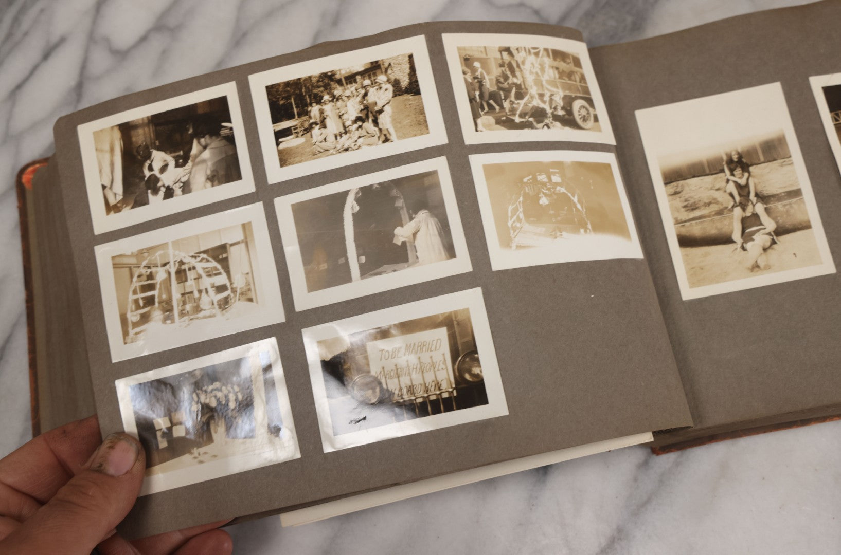 Lot 062 - Vintage Snapshot Photo Album With 125+ Photographs Including Photos Of Spirit Of St. Louis Plane, Redwood Forest, Automobiles, Outings, Comic Wedding Posters, Statue Of Liberty, Beachwear, And More