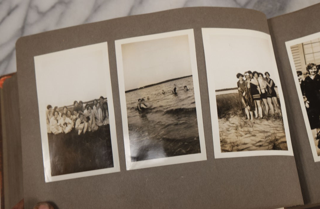 Lot 062 - Vintage Snapshot Photo Album With 125+ Photographs Including Photos Of Spirit Of St. Louis Plane, Redwood Forest, Automobiles, Outings, Comic Wedding Posters, Statue Of Liberty, Beachwear, And More