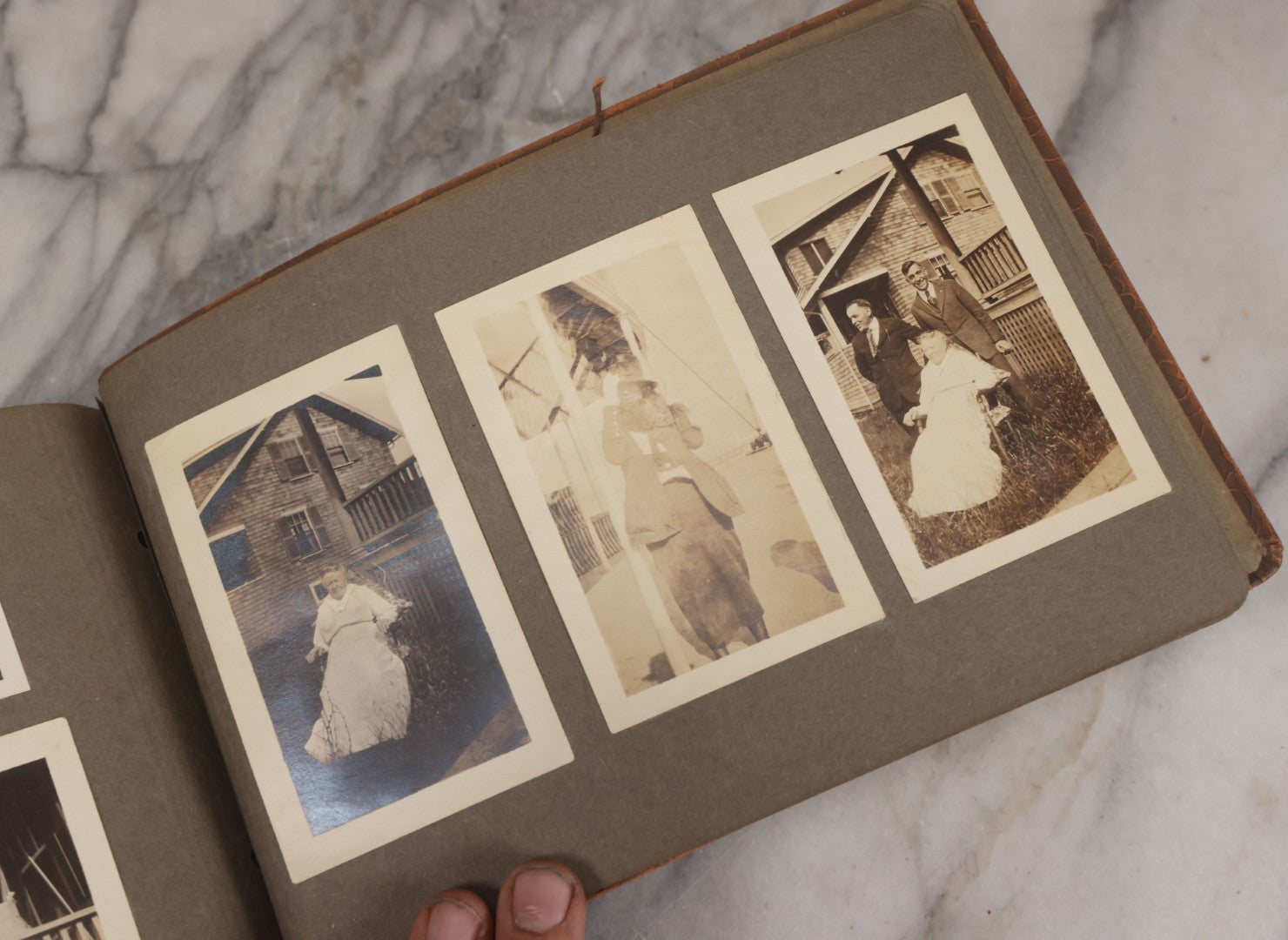 Lot 062 - Vintage Snapshot Photo Album With 125+ Photographs Including Photos Of Spirit Of St. Louis Plane, Redwood Forest, Automobiles, Outings, Comic Wedding Posters, Statue Of Liberty, Beachwear, And More