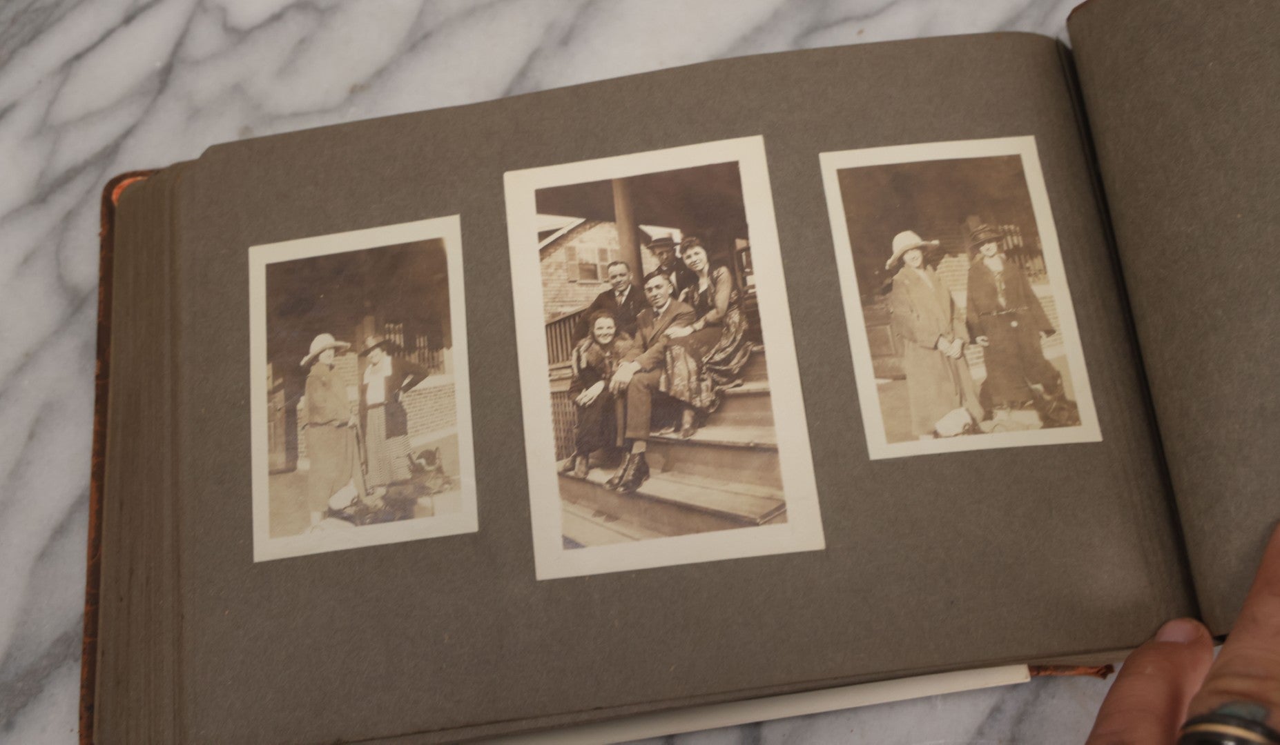 Lot 062 - Vintage Snapshot Photo Album With 125+ Photographs Including Photos Of Spirit Of St. Louis Plane, Redwood Forest, Automobiles, Outings, Comic Wedding Posters, Statue Of Liberty, Beachwear, And More