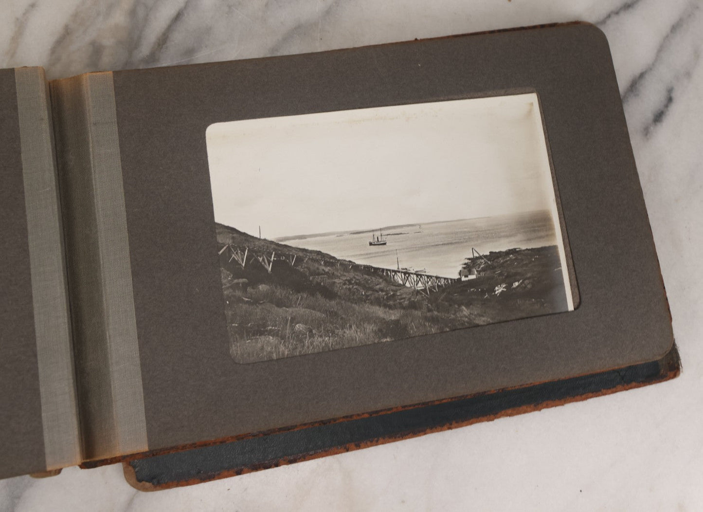 Lot 063 - Antique Snapshot Photo Album With 24 Photographs Of Turn Of The Century Coastal Towns And Farms With Group Photos Of Beach And Other Outings, Likely Maine, New England, Note Cover Detached