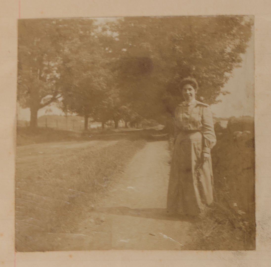 Lot 064 - Antique Snapshot Photo Album Scrapbook Contained In A Record Ledger With 40+ Photos And Scraps, With Handwritten Enscriptions, Including Interior Photos, Outdoor Photos, And More, Circa 1900, Hand Drawn Flower Scraps