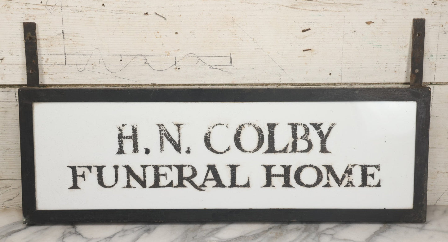 Lot 001 - Vintage Hand Painted Sign For "H.N. Colby Funeral Home" Lawrence, Massachusetts, In Metal Frame With Brackets, Painted On Vitrolite "Better Than Marble Composite Material," Circa 1940s, 25-5/8" L x 8-1/2" H