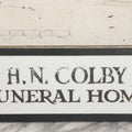Lot 001 - Vintage Hand Painted Sign For "H.N. Colby Funeral Home" Lawrence, Massachusetts, In Metal Frame With Brackets, Painted On Vitrolite "Better Than Marble Composite Material," Circa 1940s, 25-5/8" L x 8-1/2" H
