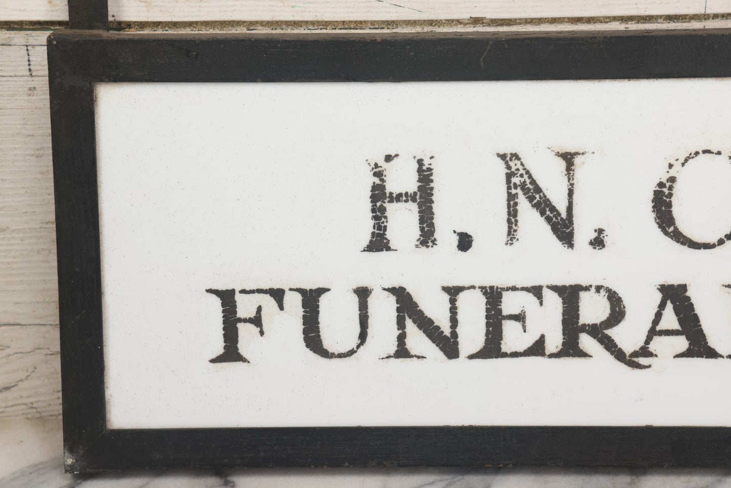 Lot 001 - Vintage Hand Painted Sign For "H.N. Colby Funeral Home" Lawrence, Massachusetts, In Metal Frame With Brackets, Painted On Vitrolite "Better Than Marble Composite Material," Circa 1940s, 25-5/8" L x 8-1/2" H