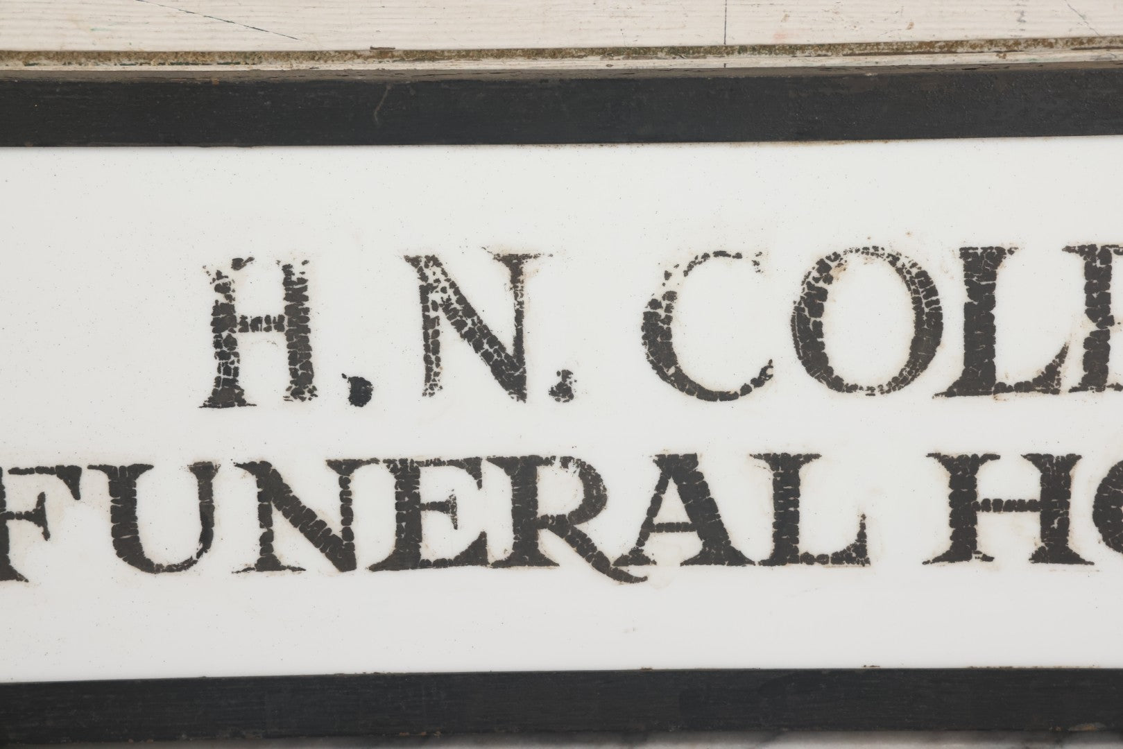 Lot 001 - Vintage Hand Painted Sign For "H.N. Colby Funeral Home" Lawrence, Massachusetts, In Metal Frame With Brackets, Painted On Vitrolite "Better Than Marble Composite Material," Circa 1940s, 25-5/8" L x 8-1/2" H