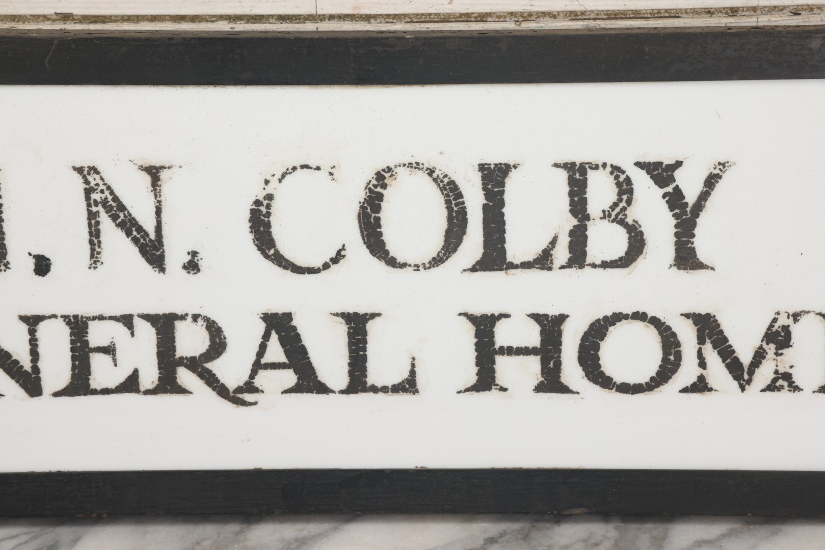 Lot 001 - Vintage Hand Painted Sign For "H.N. Colby Funeral Home" Lawrence, Massachusetts, In Metal Frame With Brackets, Painted On Vitrolite "Better Than Marble Composite Material," Circa 1940s, 25-5/8" L x 8-1/2" H