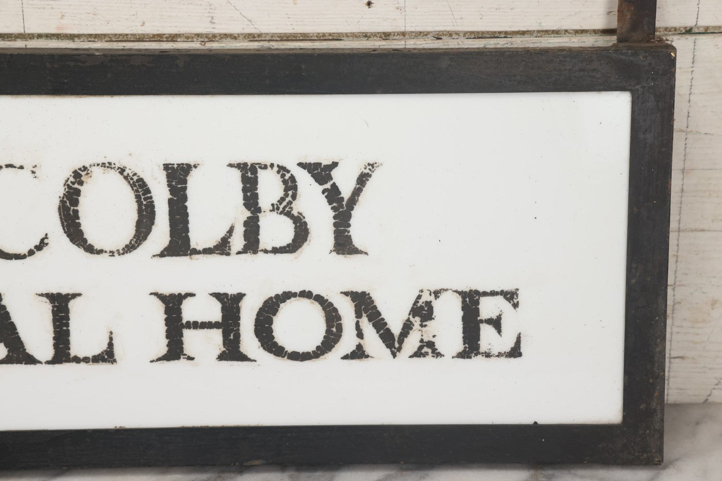 Lot 001 - Vintage Hand Painted Sign For "H.N. Colby Funeral Home" Lawrence, Massachusetts, In Metal Frame With Brackets, Painted On Vitrolite "Better Than Marble Composite Material," Circa 1940s, 25-5/8" L x 8-1/2" H