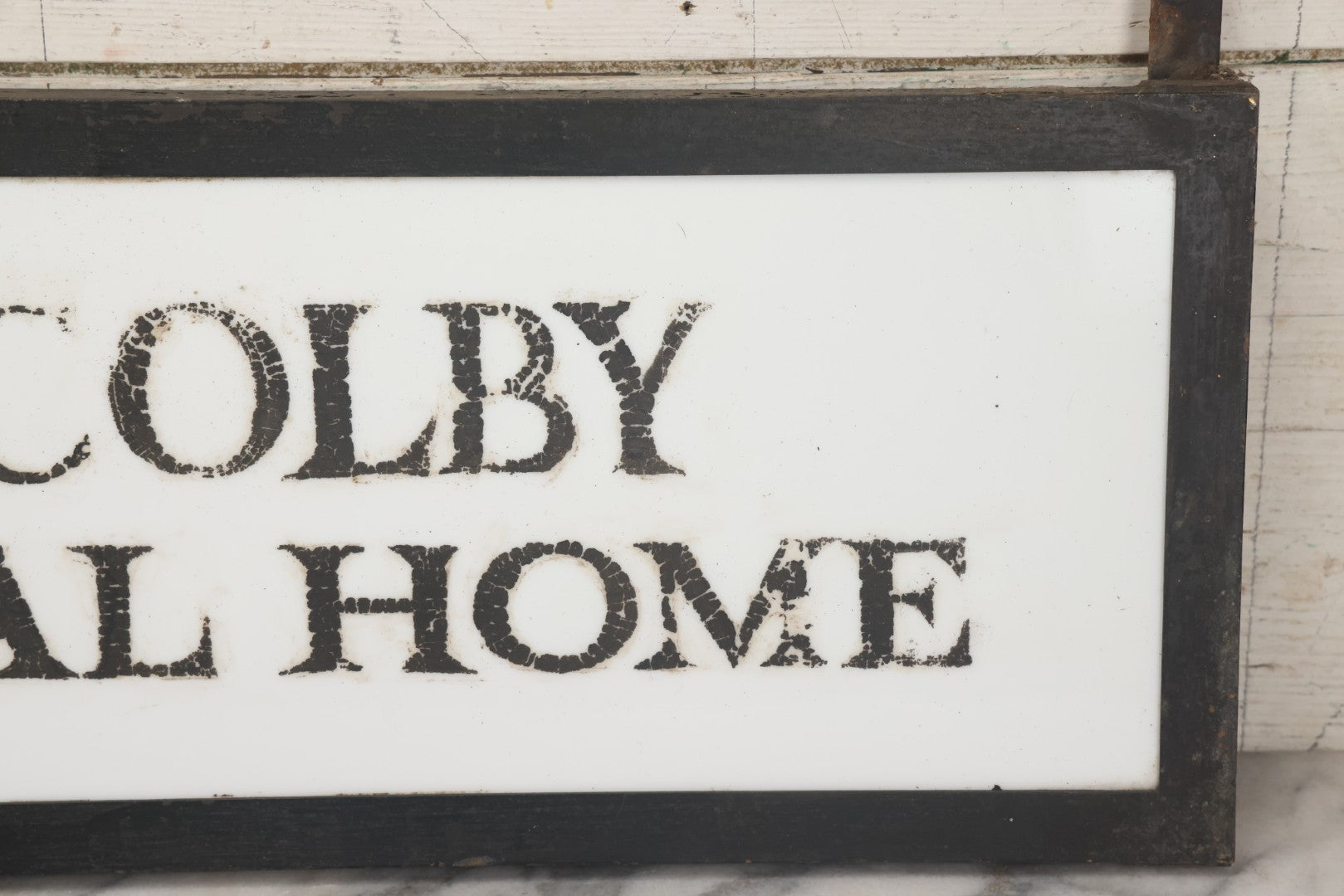 Lot 001 - Vintage Hand Painted Sign For "H.N. Colby Funeral Home" Lawrence, Massachusetts, In Metal Frame With Brackets, Painted On Vitrolite "Better Than Marble Composite Material," Circa 1940s, 25-5/8" L x 8-1/2" H