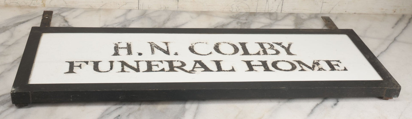 Lot 001 - Vintage Hand Painted Sign For "H.N. Colby Funeral Home" Lawrence, Massachusetts, In Metal Frame With Brackets, Painted On Vitrolite "Better Than Marble Composite Material," Circa 1940s, 25-5/8" L x 8-1/2" H