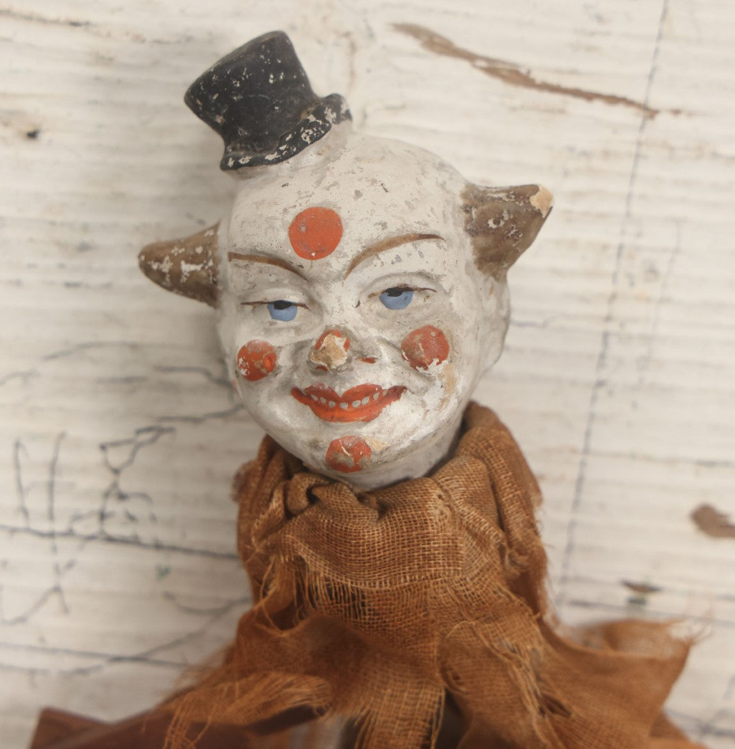 Lot 005 - Antique Animated Clown Doll With Composition Head, Remnants Of Clothes And Finger Operated Scissor Style Action