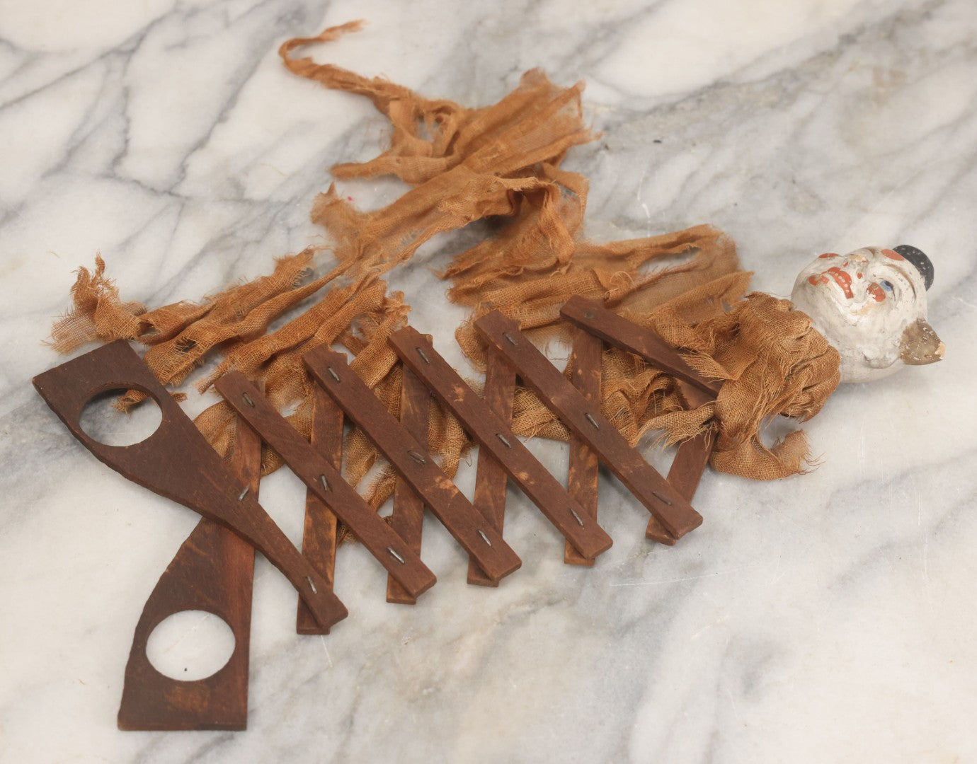 Lot 005 - Antique Animated Clown Doll With Composition Head, Remnants Of Clothes And Finger Operated Scissor Style Action